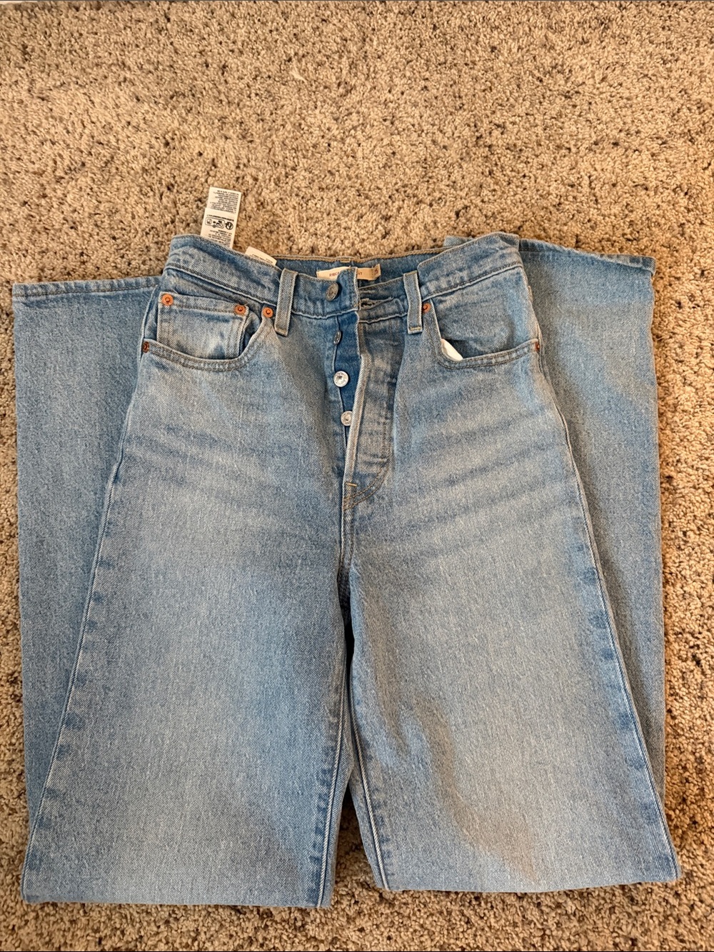 Levi's High-Rise Light Wash Button-Fly Jeans rib cage fit